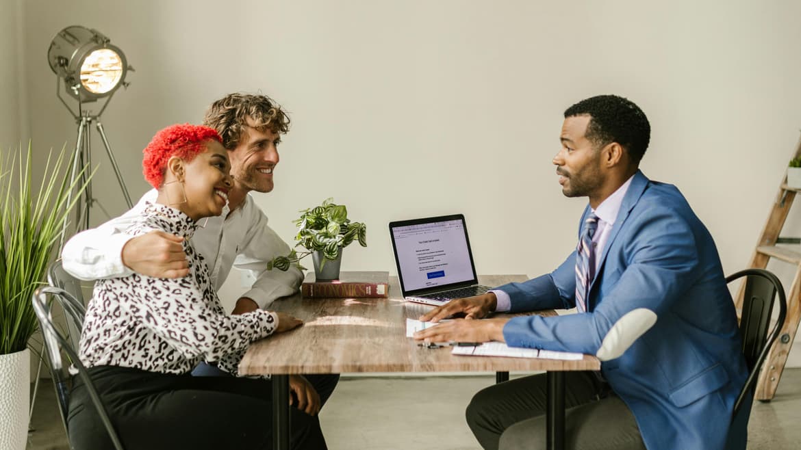 three people talk business insurance